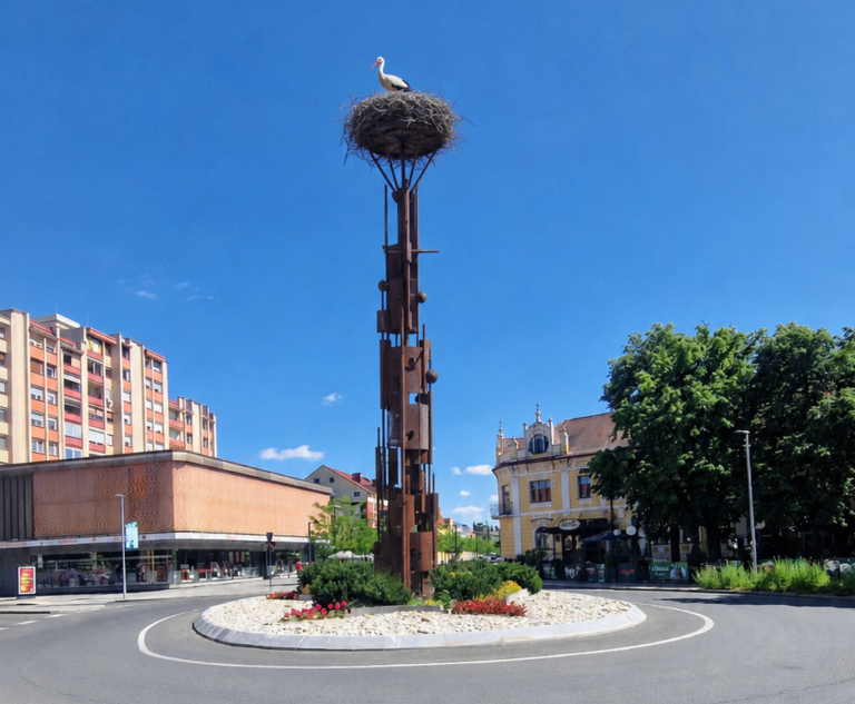 Idejna fotomontaža visokega spomenika s štorkljo v krožišču v središču Murske Sobote